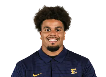 Dre Delinois headshot